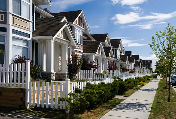 A row of new townhomes in a nice neighborhood.